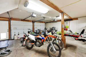Garage featuring a garage door opener