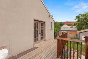 Wooden terrace featuring french doors