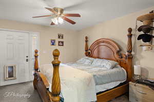 Bedroom with carpet and a ceiling fan