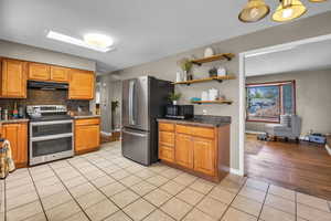 Light & Bright featuring stainless steel appliances & tons of storage.