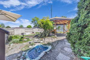 View of yard with a gazebo, a patio area, and a fenced backyard