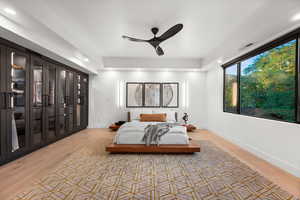 Bedroom with baseboards, visible vents, light wood finished floors, and recessed lighting