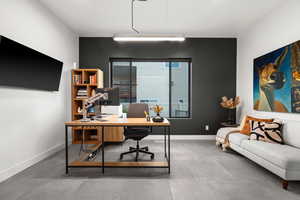 Home office featuring baseboards