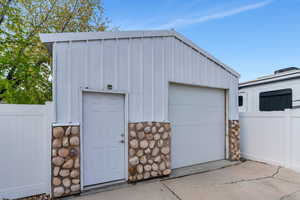 Garage featuring fence