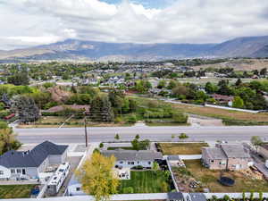 Aerial perspective of suburban area with a mountainous background