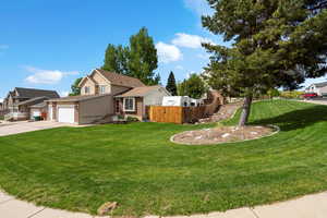 View of front of house featuring concrete driveway, an attached garage, brick siding, and stucco siding