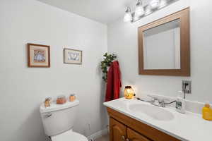 Bathroom featuring vanity and toilet