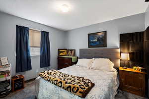 Carpeted bedroom with baseboards