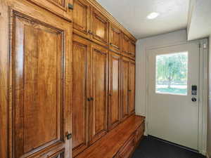 Mudroom featuring carpet