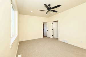 Owner's bedroom featuring carpet floors, baseboards, recessed lighting, and ceiling fan