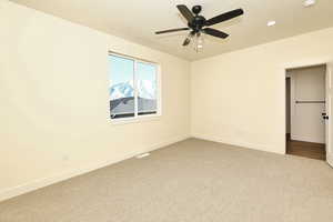 Bedroom featuring light colored carpet, recessed lighting, baseboards, a ceiling fan, and a textured ceiling