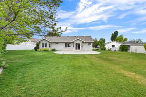 Back of house featuring a patio and stucco siding