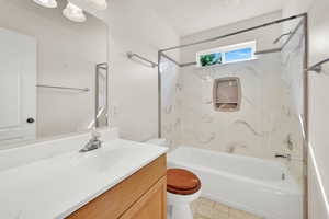 Full bath with toilet, bathtub / shower combination, vanity, and tile patterned floors