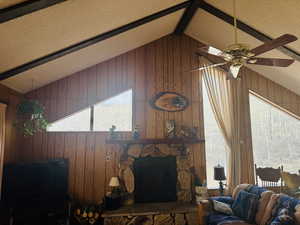 Living living room vaulted ceiling and large welcoming wood burning  fireplace