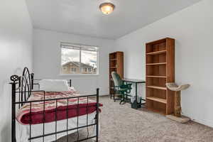 Carpeted bedroom featuring baseboards