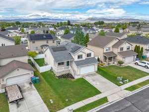 Aerial view of residential area featuring a mountainous background