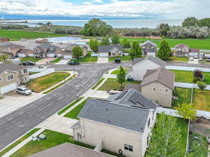 Aerial perspective of suburban area featuring a large body of water