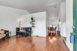 Sitting room with wood finished floors and baseboards