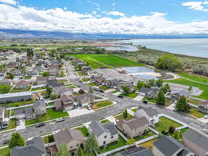 Aerial perspective of suburban area with a large body of water