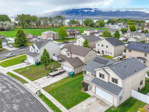Aerial perspective of suburban area featuring a mountainous background