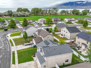 Aerial view of residential area featuring a nearby body of water