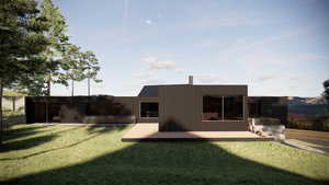 Back of property with a wooden deck and a yard