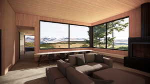 Sunroom with a mountain view