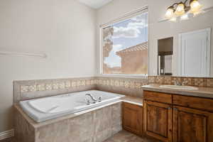 Bathroom with a garden tub and vanity
