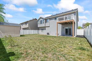 Rear view of property with a storage unit, a fenced backyard, cooling unit, an outdoor structure, and a yard