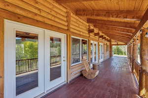 Wooden deck featuring french doors