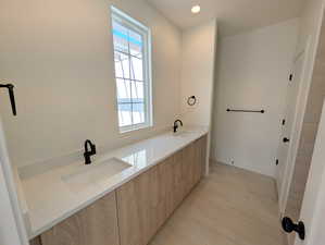 Primary Full bath with double vanity and recessed lighting