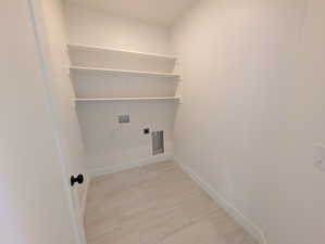 Washroom with hookup for an electric dryer and washer hookup