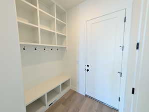 Mudroom with light wood-style floors