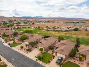 Aerial perspective of suburban area featuring a mountainous background
