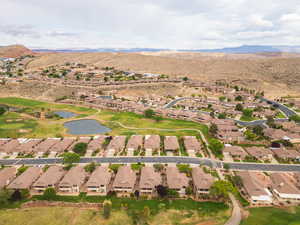 View of property location with nearby suburban area and a water and mountain view