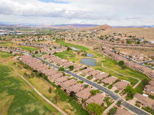 Aerial overview of property's location with a water and mountain view and nearby suburban area