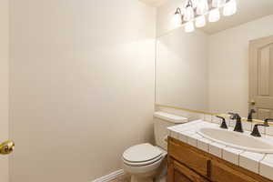 Bathroom featuring toilet and vanity