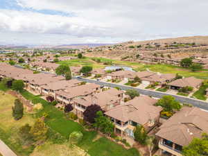 Aerial perspective of suburban area with a mountainous background