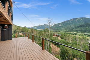Wooden deck featuring a mountain view