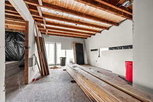Misc room featuring beamed ceiling and wooden ceiling