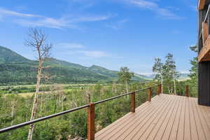 Wooden deck featuring a mountain view