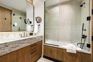 Full bathroom with vanity and tiled shower / bath combo