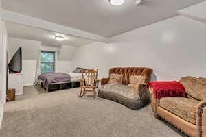 Bedroom featuring carpet flooring and baseboards