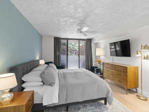 Bedroom featuring light wood-style flooring and a ceiling fan