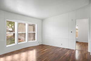 Unfurnished room with wood finished floors