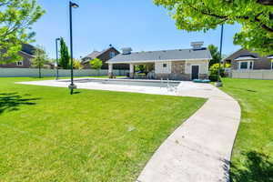 Rear view of property with a patio and stone siding