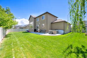 Back of property featuring a patio area and stucco siding