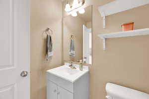 Bathroom with toilet and vanity