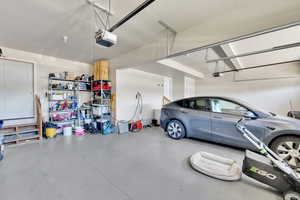 Garage featuring a garage door opener