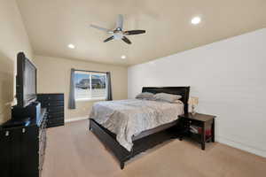 Bedroom featuring light colored carpet, baseboards, recessed lighting, and ceiling fan